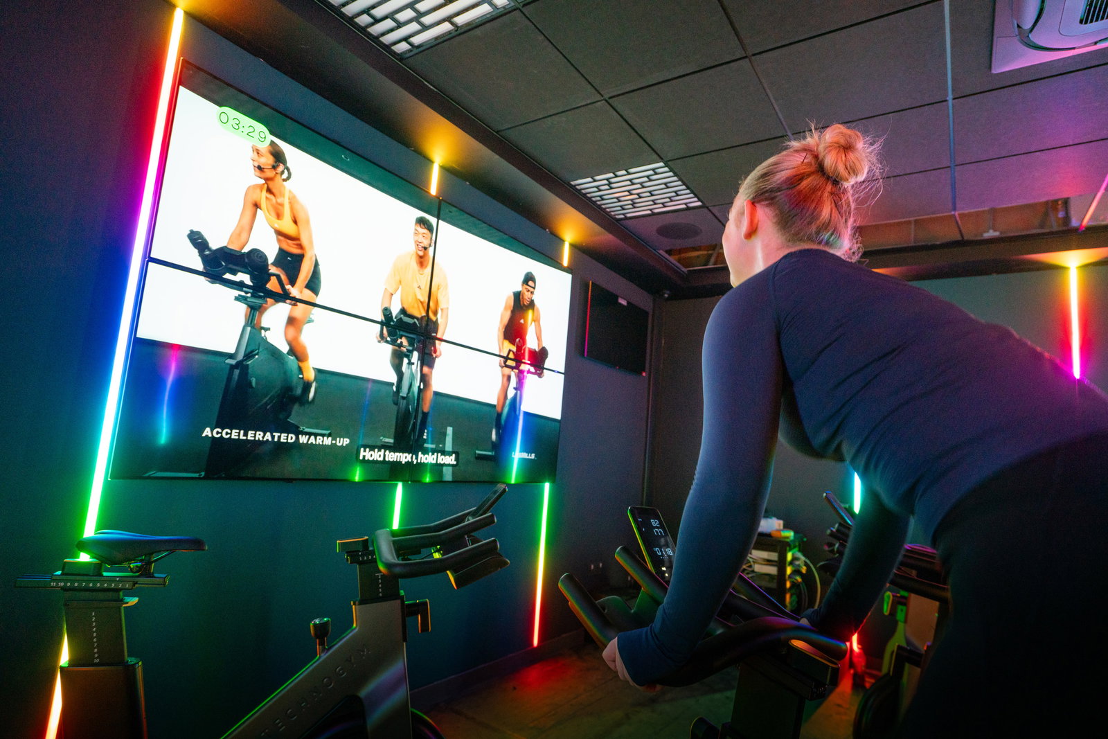 A fitness class in a light studio