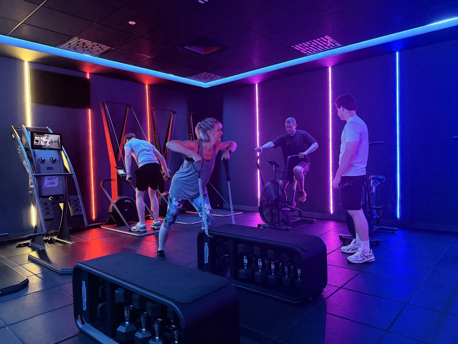 A fitness class in a light studio