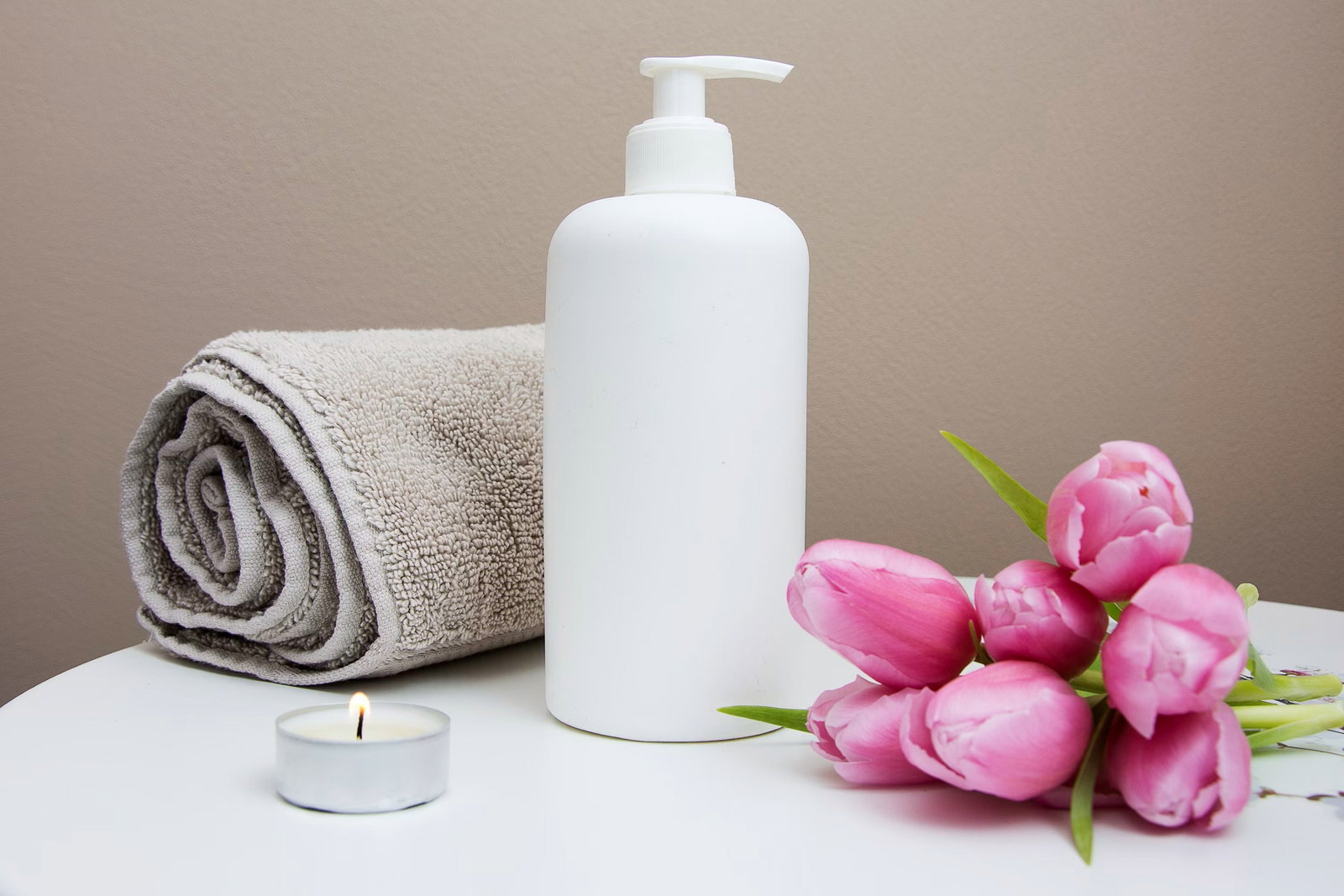 Spa towels and treatment products arranged neatly